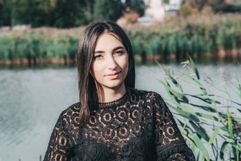 Woman Wearing Black Lace Top