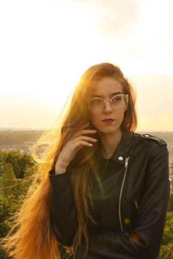 Woman Wearing Black Leather Bikers Jacket and Sunglasses