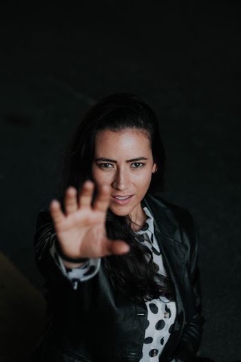 woman wearing black leather jacket