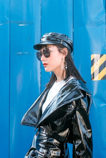 Woman Wearing Black Leather Jacket and White Top