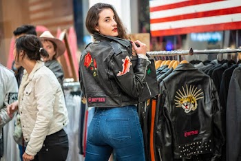 Woman Wearing Black Leather Jacket Showing Back