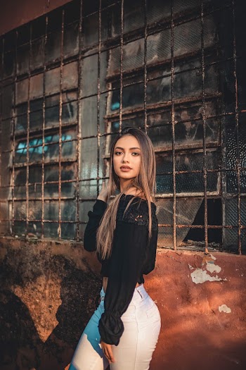Woman Wearing Black Long-sleeved Crop Top