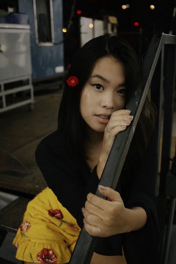 Woman Wearing Black Long-sleeved Shirt Holding Black Handrails
