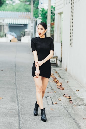 Woman Wearing Black Mini Dress and Black Boots