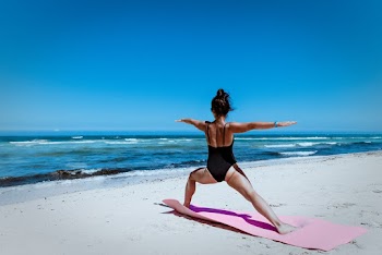 Woman Wearing Black Monokini Doing Yoga at Shore