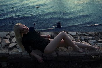 woman wearing black monokini near body of water