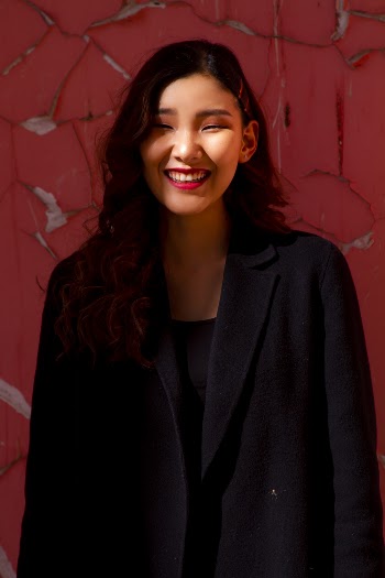 Woman Wearing Black Notched Lapel Coat