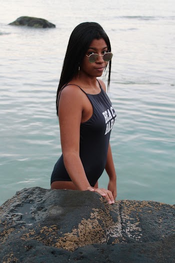 Woman Wearing Black One-piece Suit