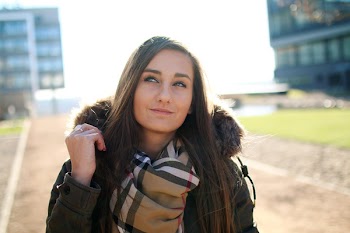Woman Wearing Black Parka Jacket Smiling
