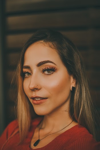 Woman Wearing Black Pendant