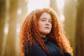Woman Wearing Black Polo Shirt