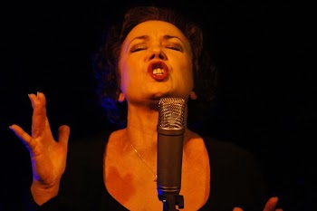 Woman Wearing Black Scoop Neck Shirt Using Microphone With Stand