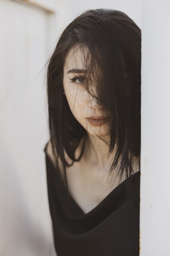 Woman Wearing Black Scoop-neck Top