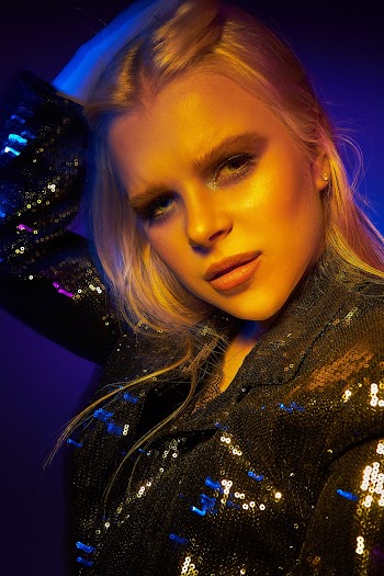 Woman Wearing Black Sequin Coat