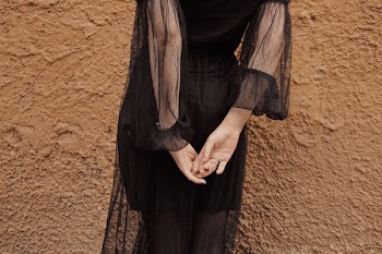 Woman Wearing Black Sheer Long-sleeved Dress