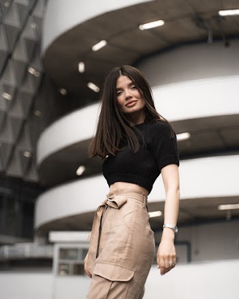 Woman Wearing Black Shirt and Brown Pants