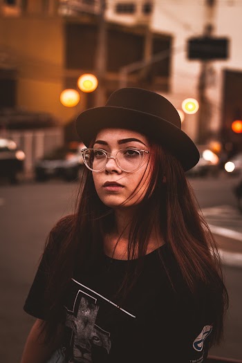 Woman Wearing Black Shirt And Hat