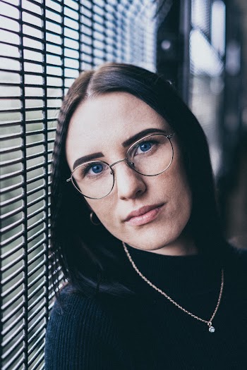 Woman Wearing Black Shirt and Necklace