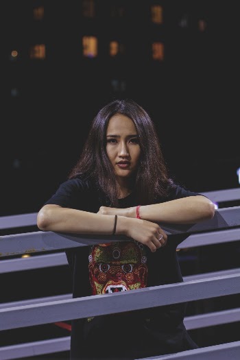 Woman Wearing Black Shirt Leaning on Railing