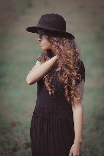Woman Wearing Black Short-sleeved Dress and Black Sunhat