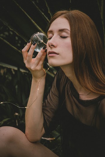 Woman Wearing Black Short-sleeved Top Holding Ball