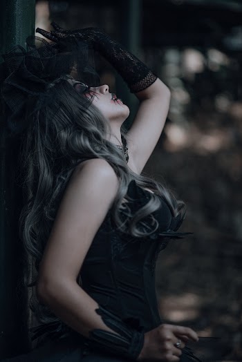 Woman Wearing Black Sleeveless Dress