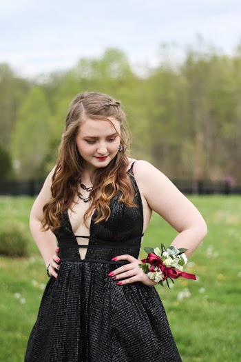 Woman Wearing Black Sleeveless Dress