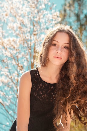 Woman Wearing Black Sleeveless Lace Top