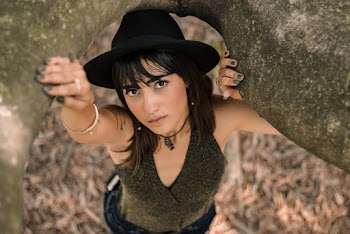 Woman Wearing Black Sleeveless Top