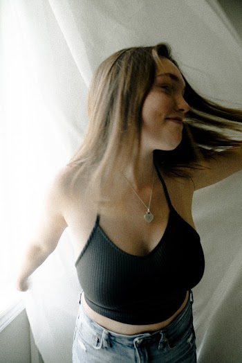 Woman Wearing Black Spaghetti-strap Crop-top