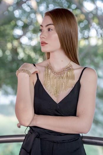 Woman Wearing Black Spaghetti Strap Dress Looking Sideways 