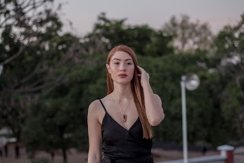 Woman Wearing Black Spaghetti Strap Top