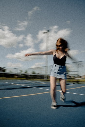 Woman Wearing Black Spaghetti-strap Top