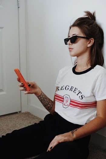 Woman Wearing Black Sunglasses Holding Android Smartphone