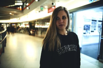 Woman Wearing Black Supreme Sweater