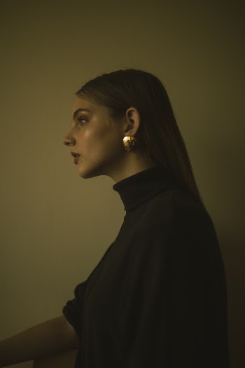 Woman Wearing Black Sweater
