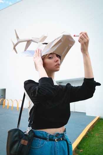 Woman Wearing Black Sweater Holding Deer Mask