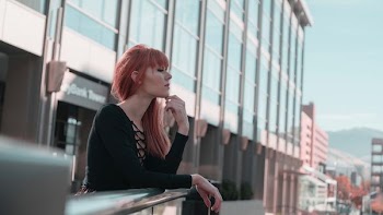 woman wearing black sweater while being photograph