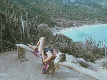 Woman Wearing Black Swimsuit Lying on Bench