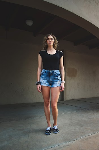Woman Wearing Black T-shirt And Denim Short