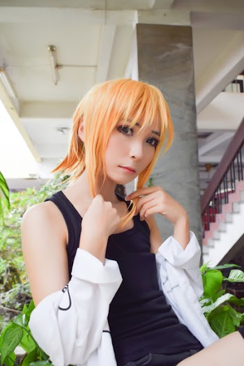 Woman Wearing Black Tank Top and Orange Wig Near White Stairs