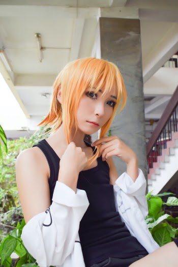 Woman Wearing Black Tank Top and Orange Wig Near White Stairs