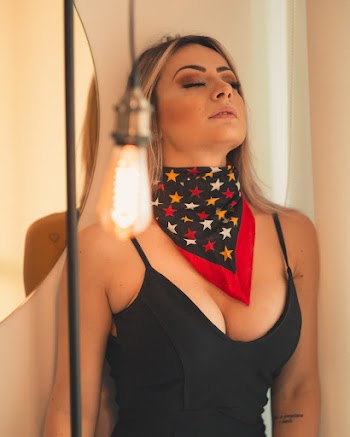Woman Wearing Black Tank Top Closing Her Eyes