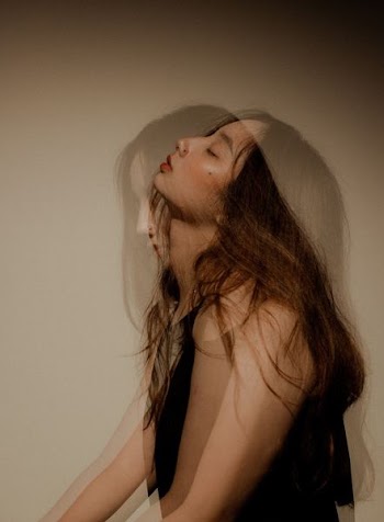 woman wearing black tank top fading photo effect