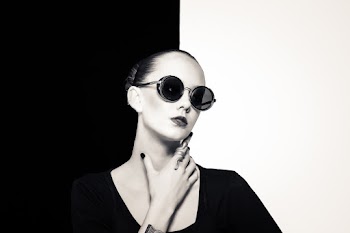 Woman Wearing Black Top and Black Framed Sunglasses
