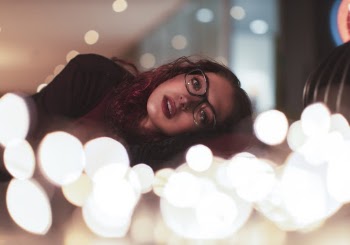 Woman Wearing Black Top and Eyeglasses