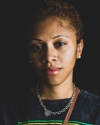 Woman Wearing Black Top and Silver-Colored Necklace