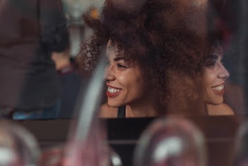Woman Wearing Black Top Smiling