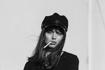 Woman Wearing Black Top While Smoking