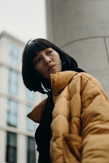 Woman Wearing Black Top With Yellow Bubble Full-zip Jacket